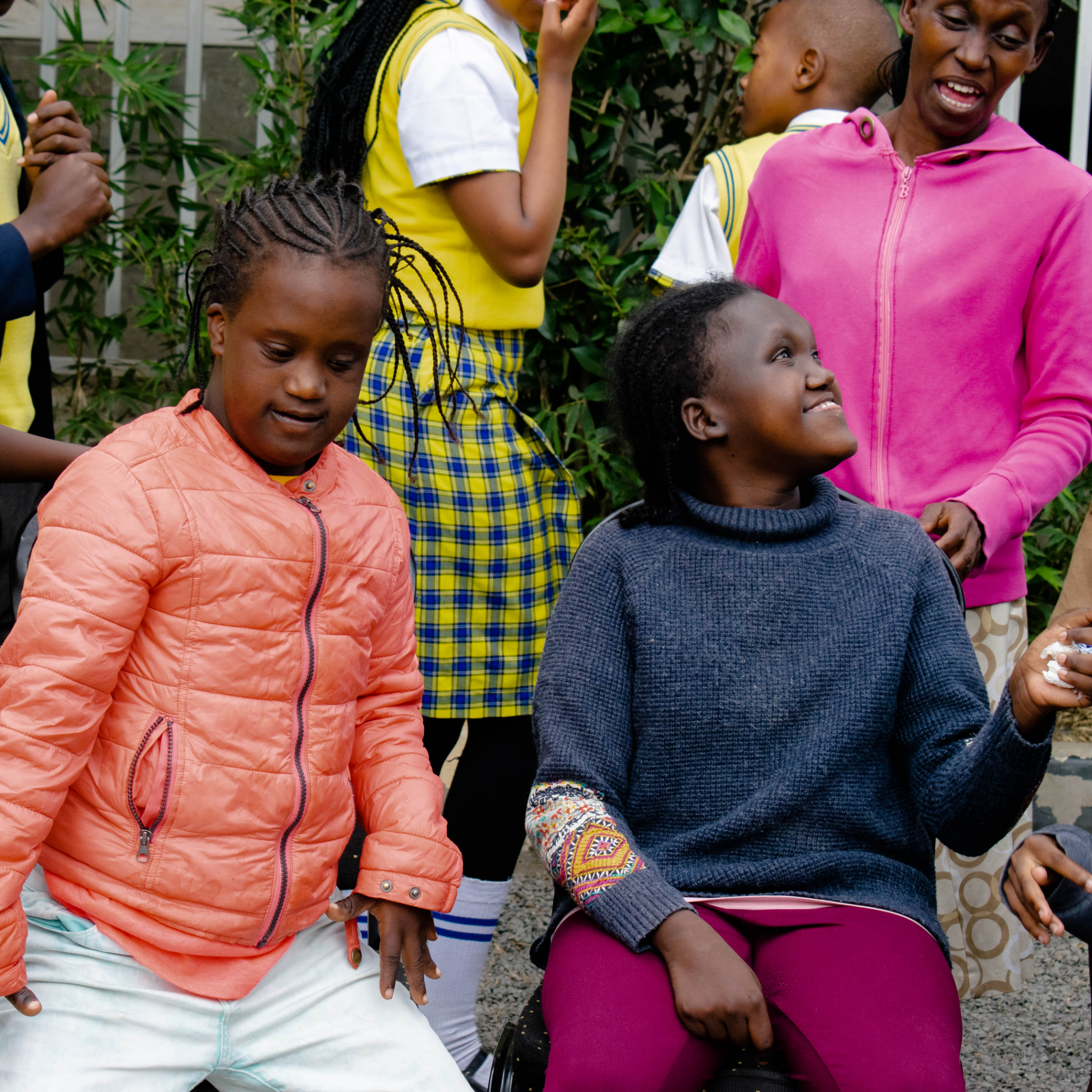 Children dancing at a community disability event in Kenya (2025). Through our global work, we are changing local perspectives so people with disabilities are supported and celebrated.