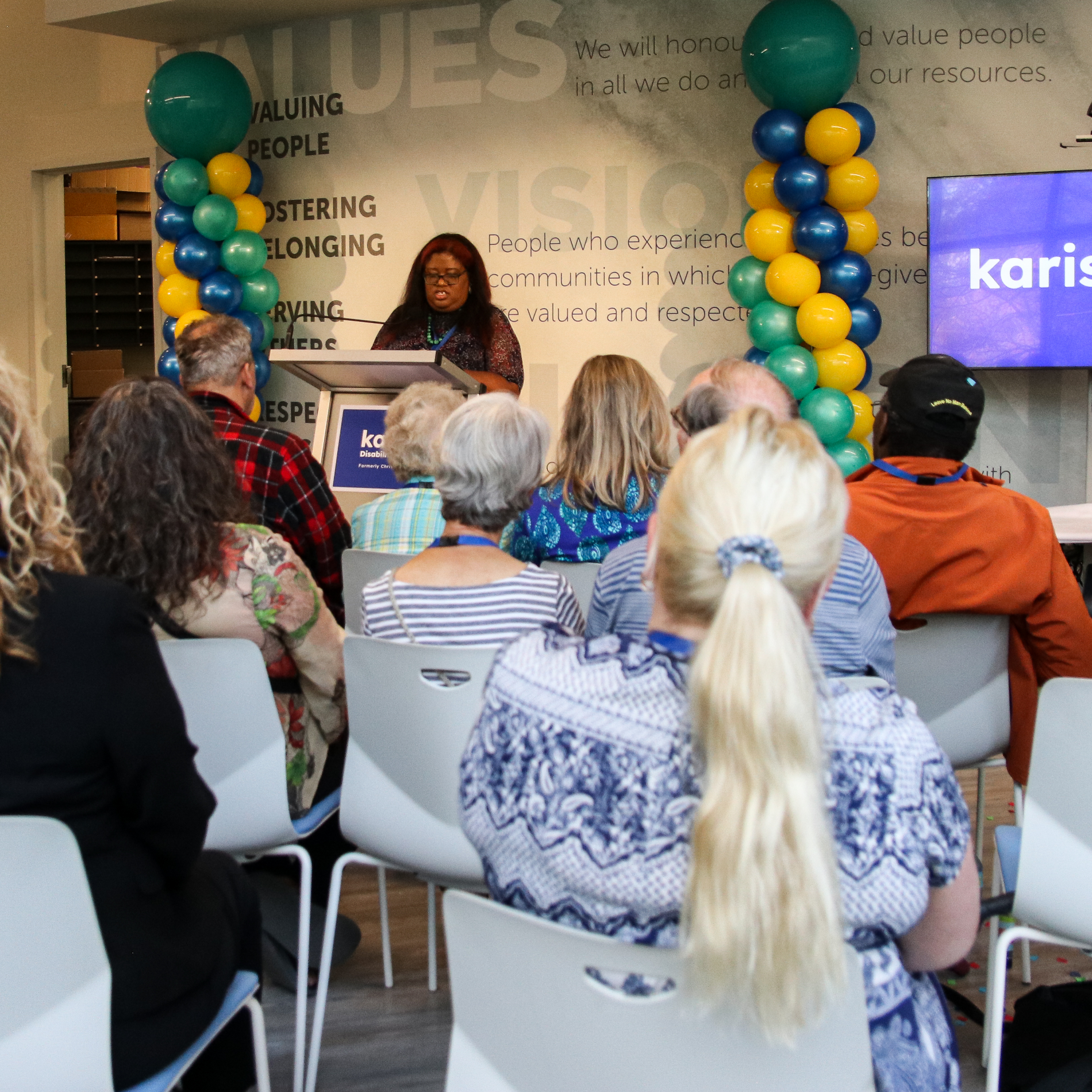 Dzidra from Our Voices Matter speaking at Karis’ rebrand event (2023).  Our Voices Matter is a network of self-advocate groups that work together to help make changes and shape policy for people with disabilities.