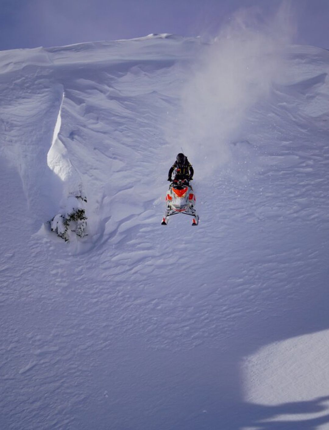 snowmobiler hitting huge drop