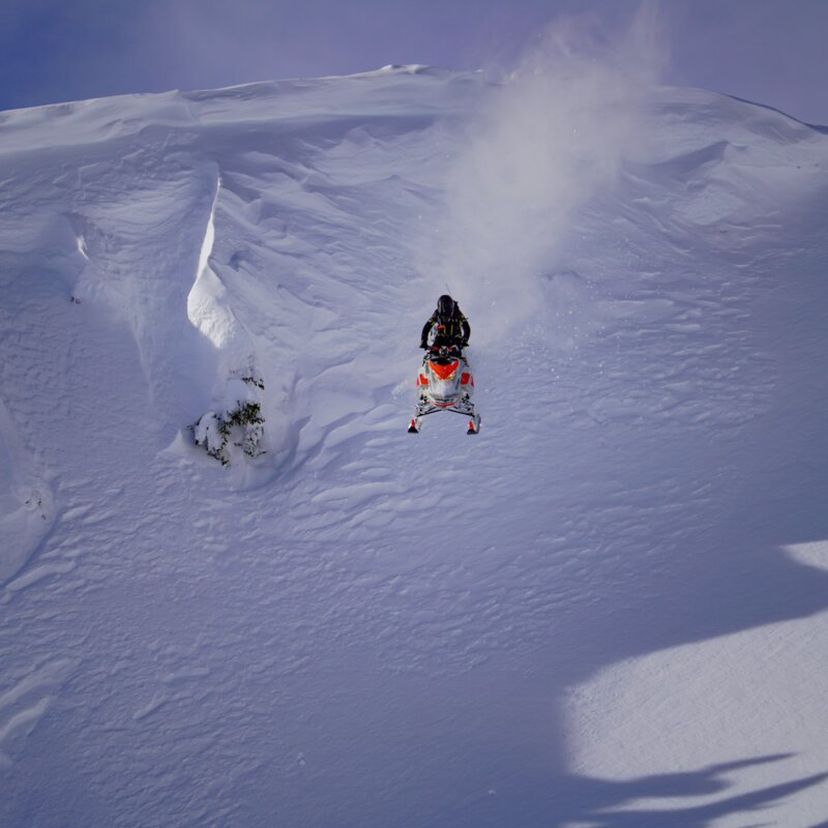 snowmobiler hitting huge drop
