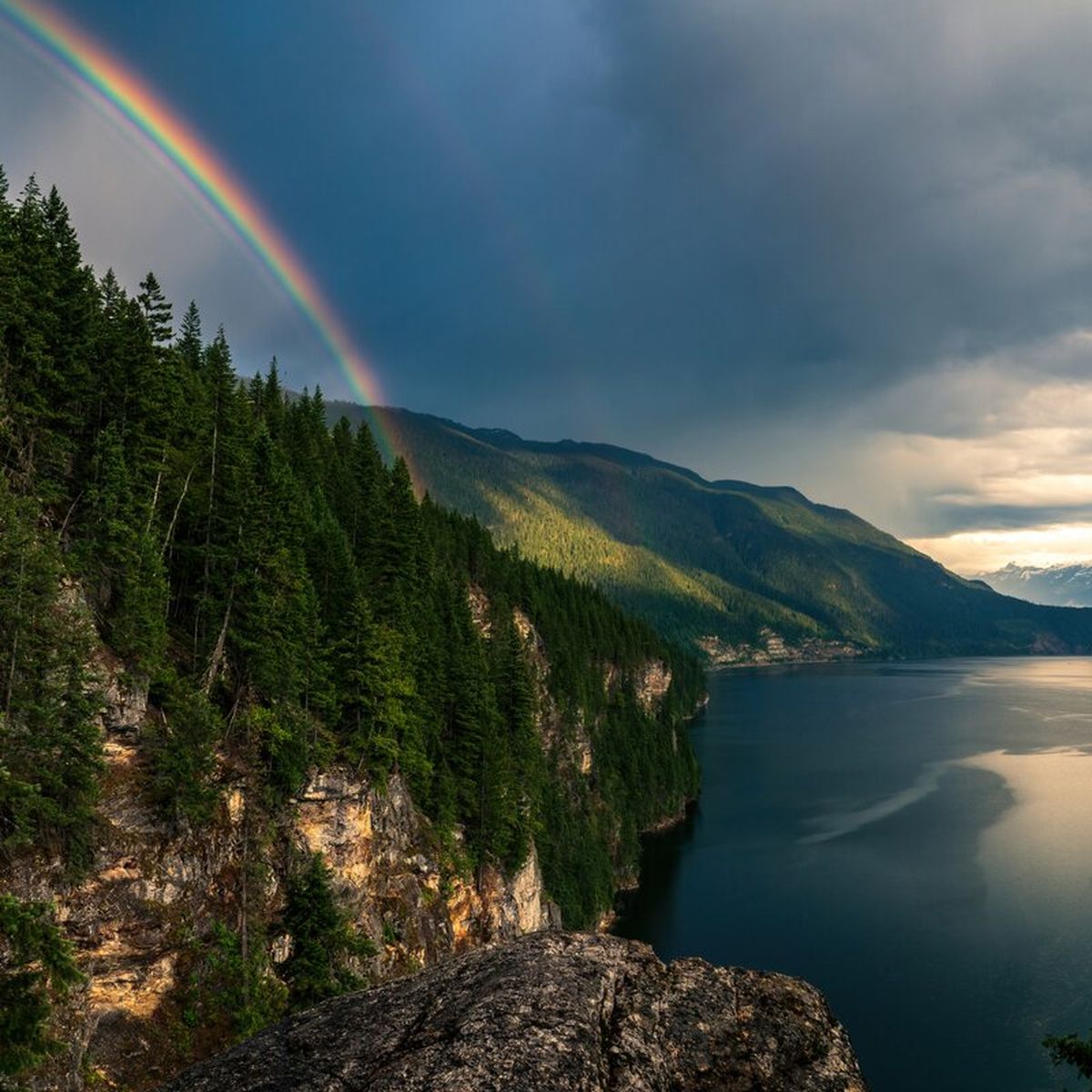 rainbow bending down to lake revelstoke