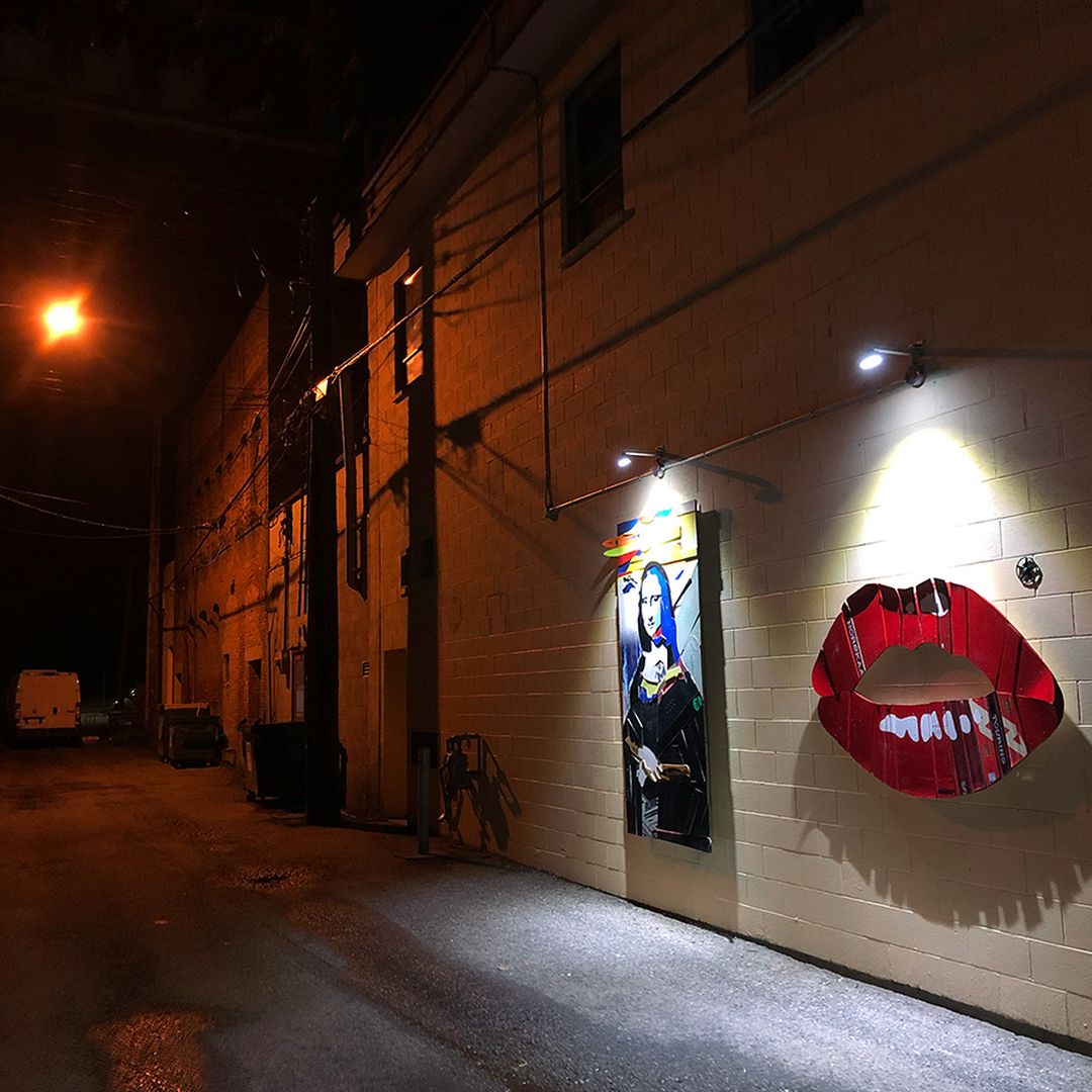 art lit up in alleyways