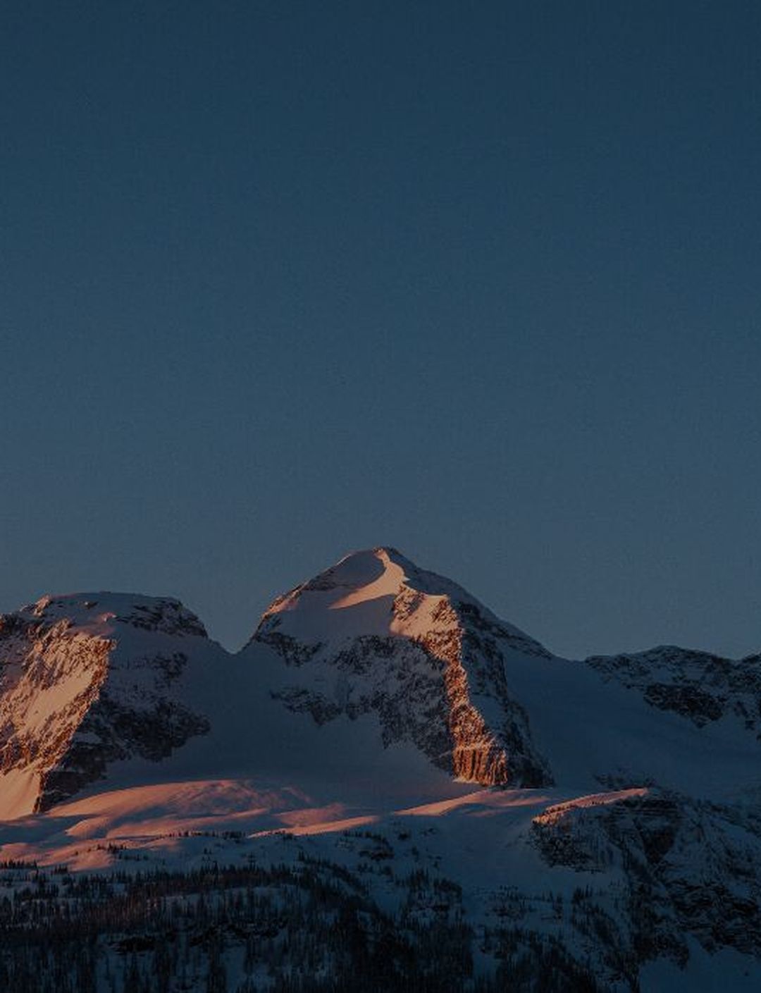 alpenglow on three peak mountain at dusk