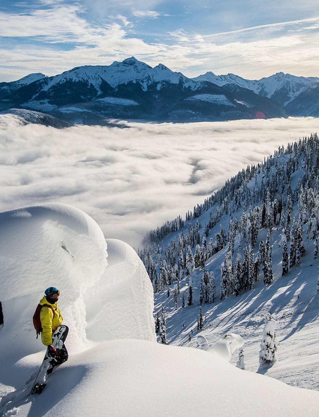 snowboarder on a powder pillow looking out