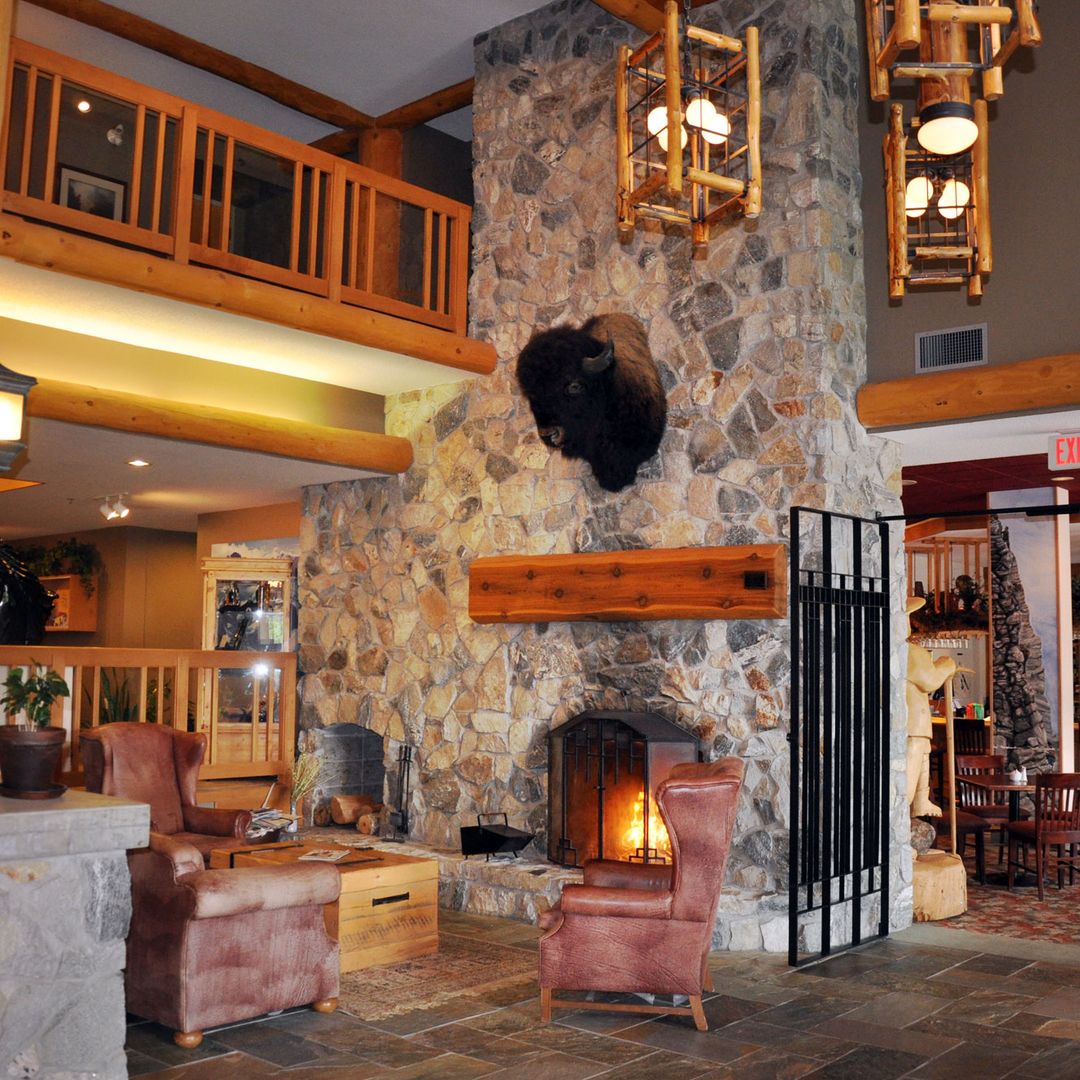 common area at hillcrest hotel with fireplace lit