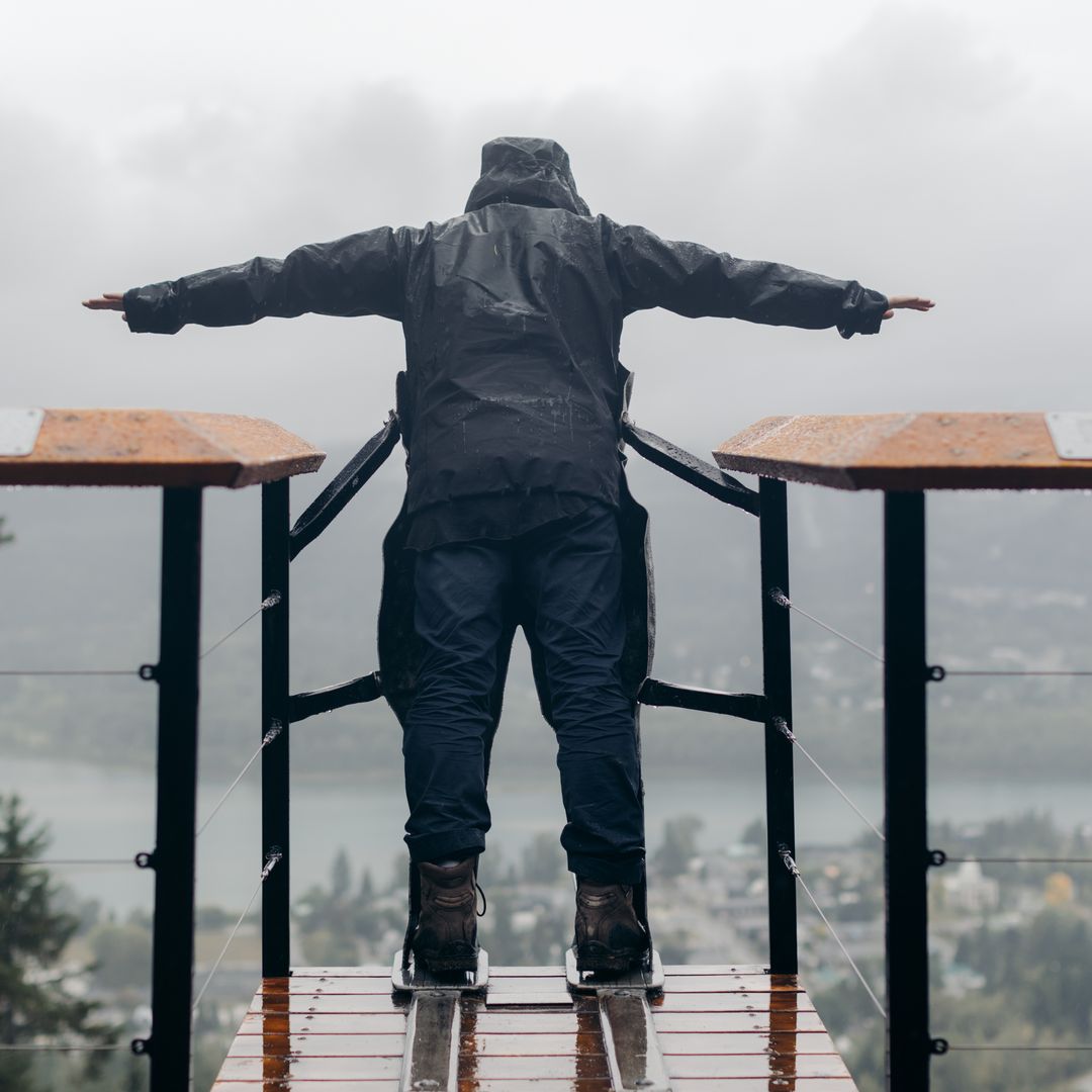 guy standing in ski jump sculpture
