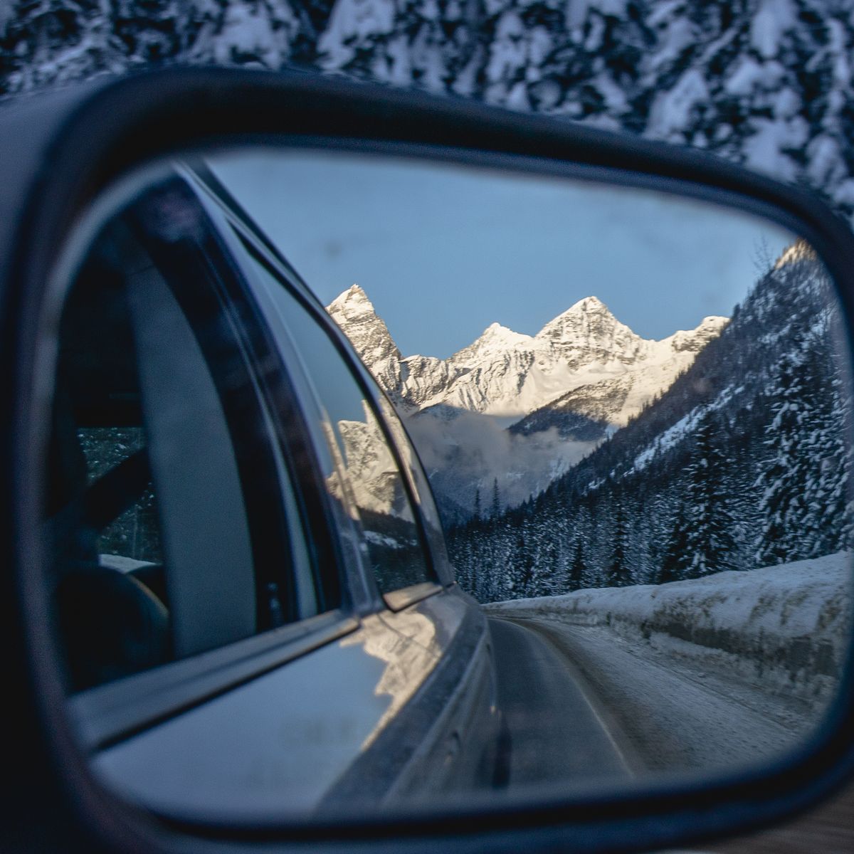 mountains through rear view mirror