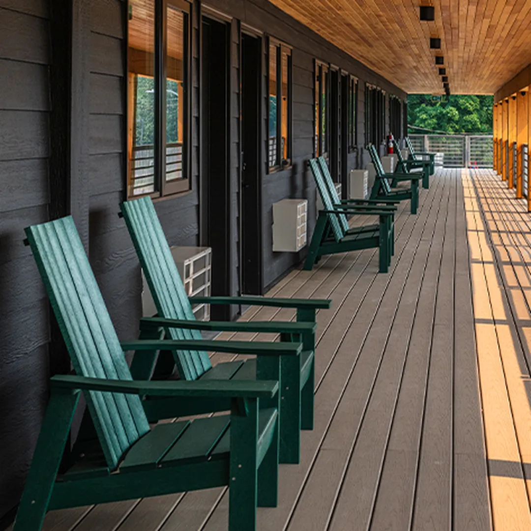 hallway outside of vrge hotel with adirondack chairs