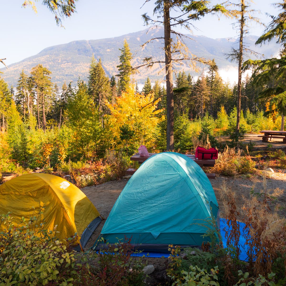 two tents set up in campsite overlooking mountains