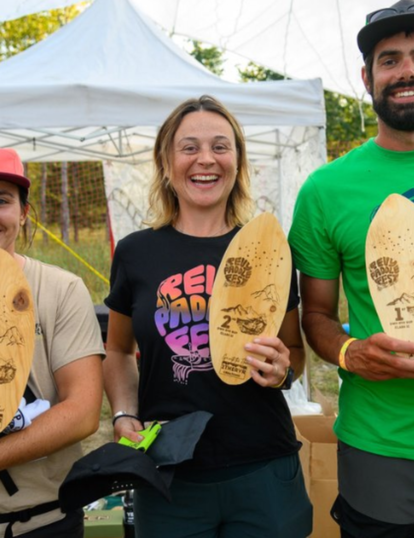 winners of paddle fest holding awards