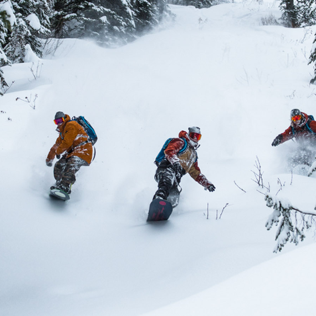 group of three snowboarding