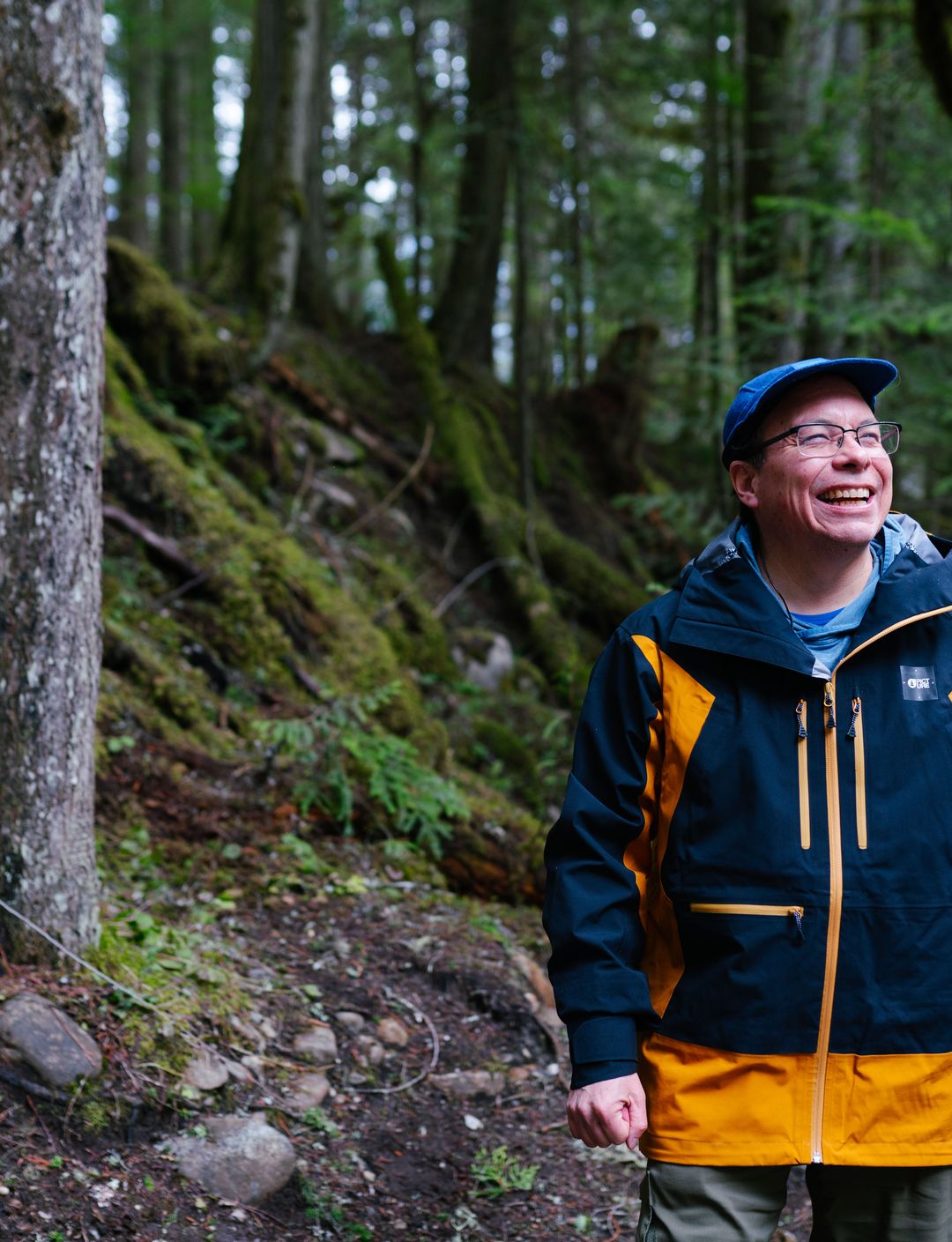 hiking guide walking in rainforest