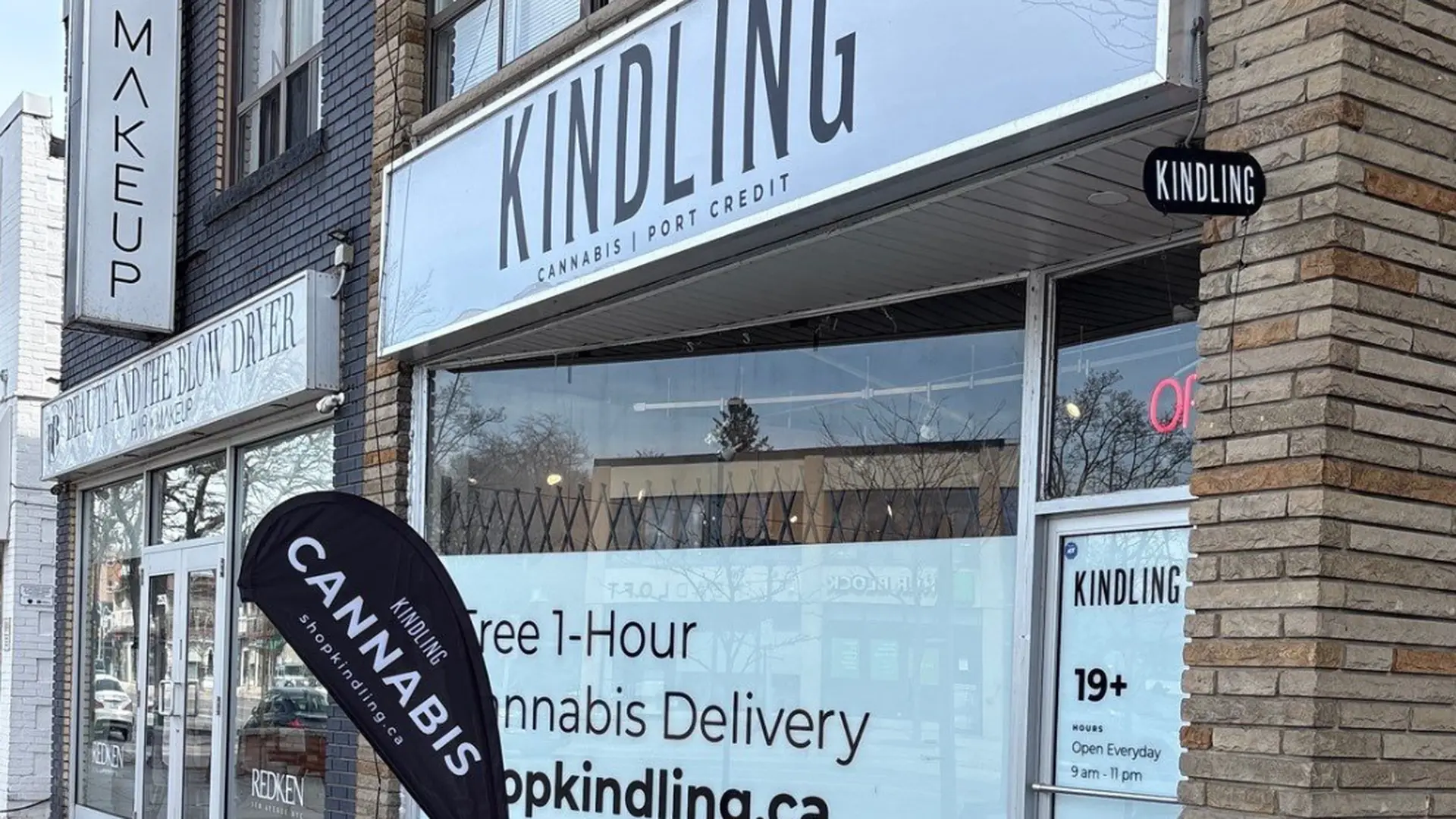 Entrance with lightbox sign at Kindling’s Mississauga cannabis store, 251 Lakeshore Rd E