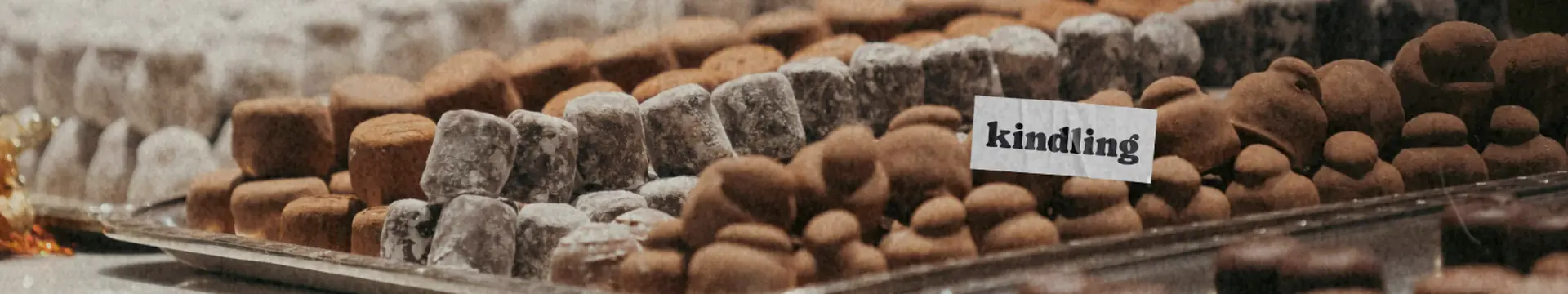 variety of chocolates and sweets with kindling cannabis dispensary logo