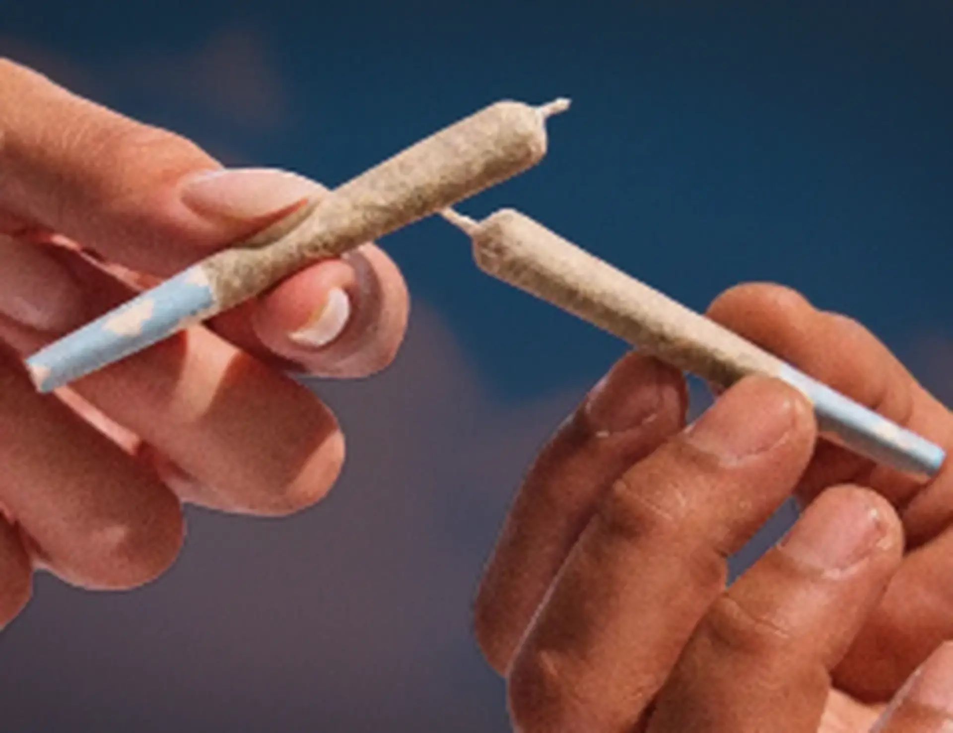 hand holding two preroll for kindling cannabis 1 hour delivery