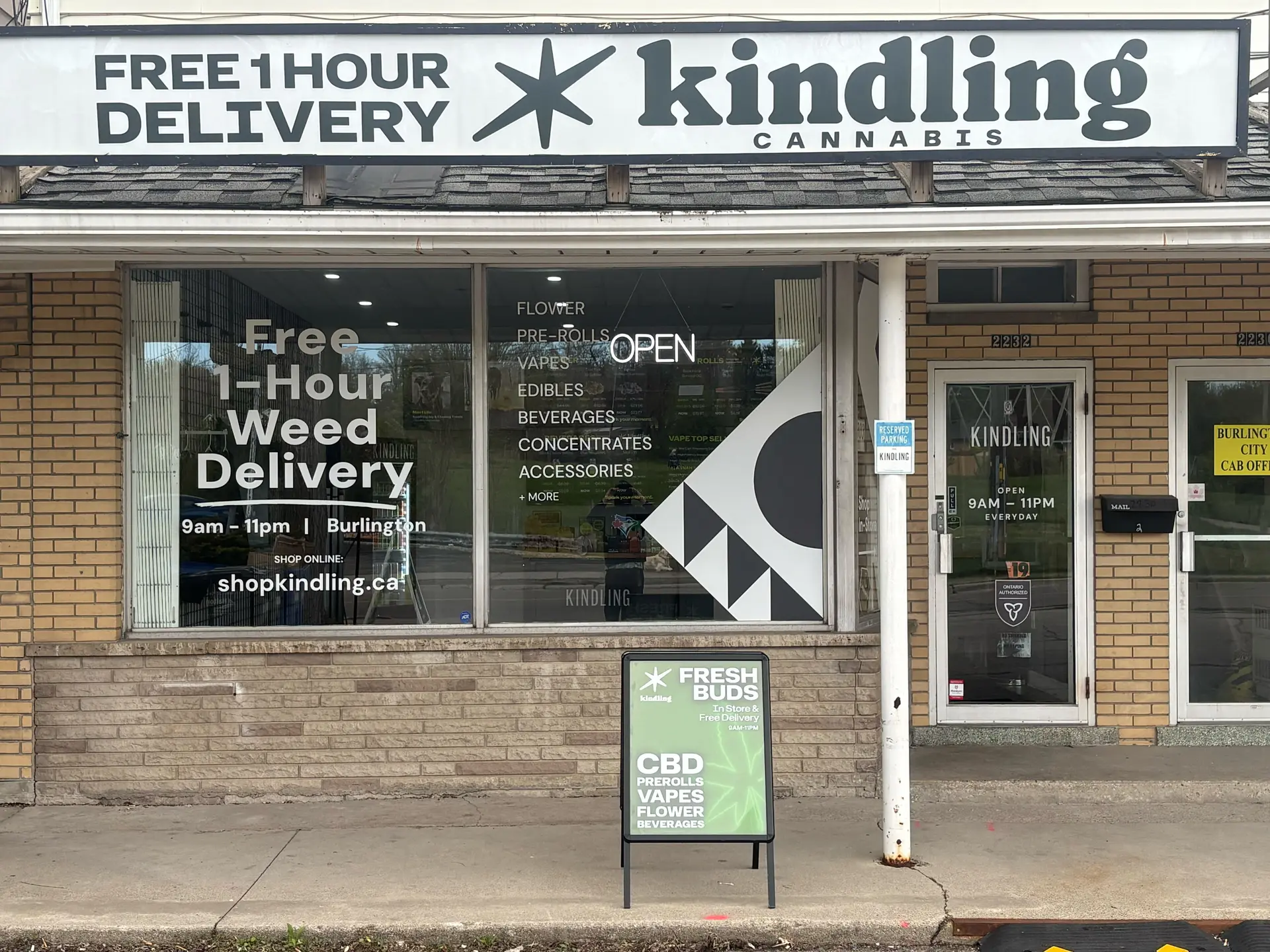 Burlington cannabis store storefront with free 1-hour cannabis delivery window sign