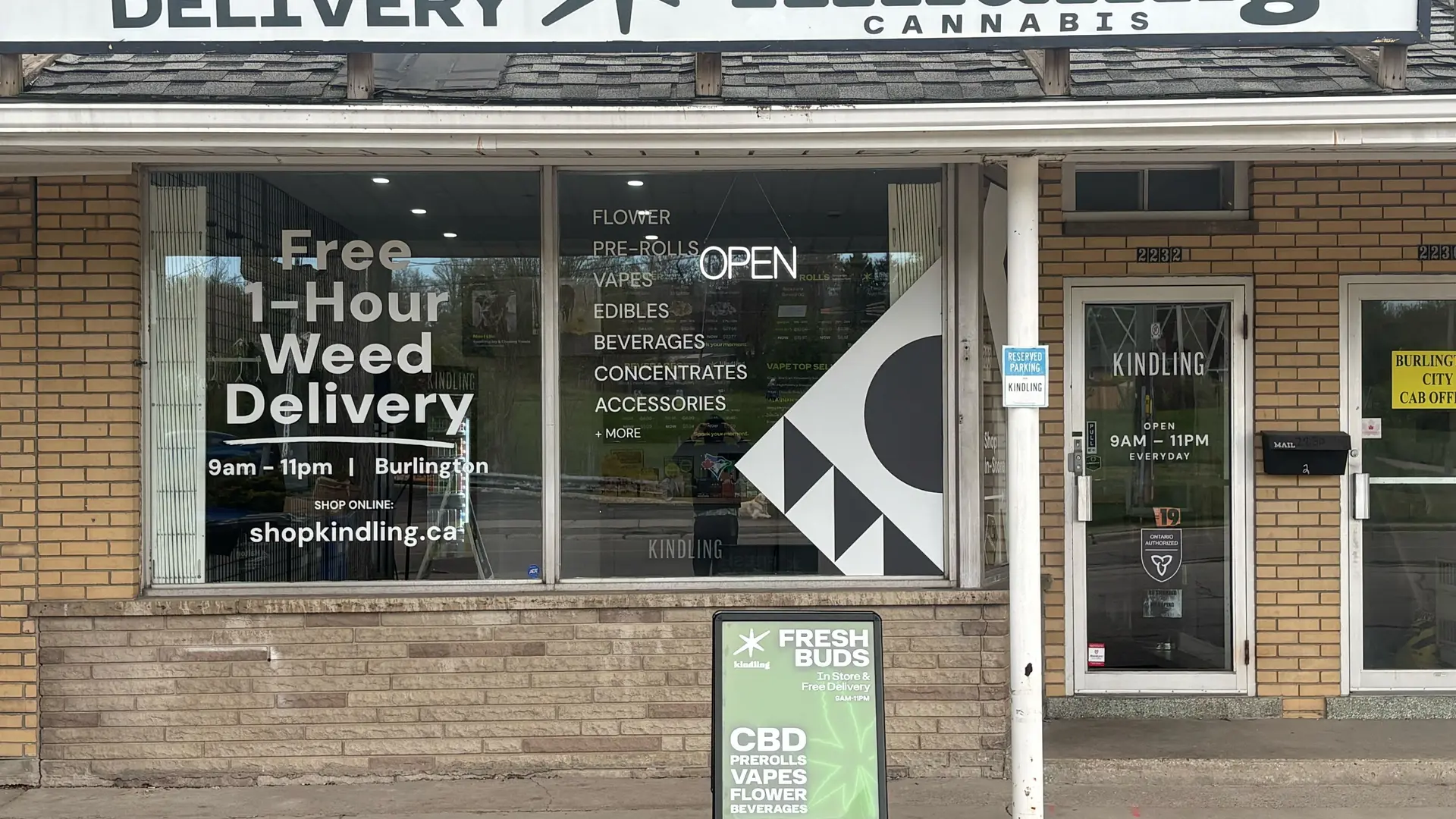 Burlington cannabis store storefront with free 1-hour cannabis delivery window sign
