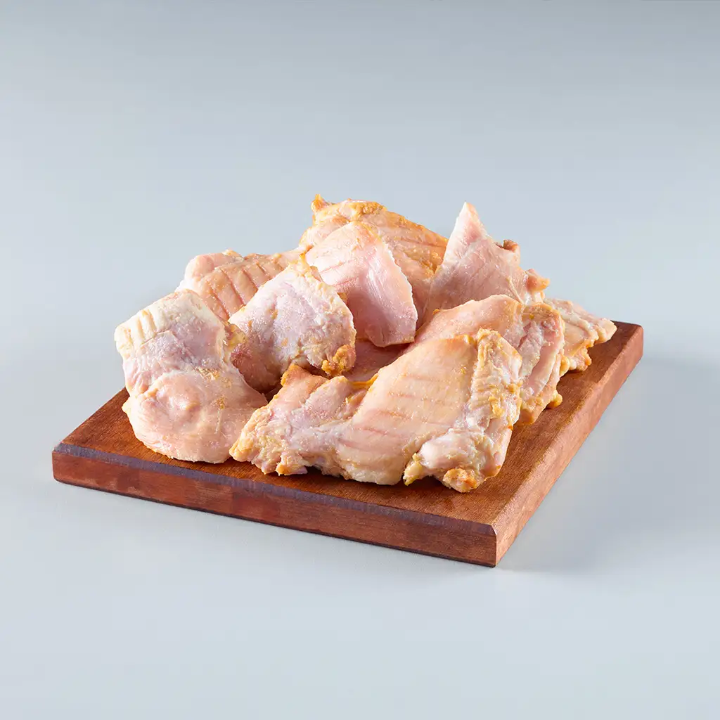 Hauts de cuisse de poulet désossés, sans peau, assaisonnés, entièrement cuits