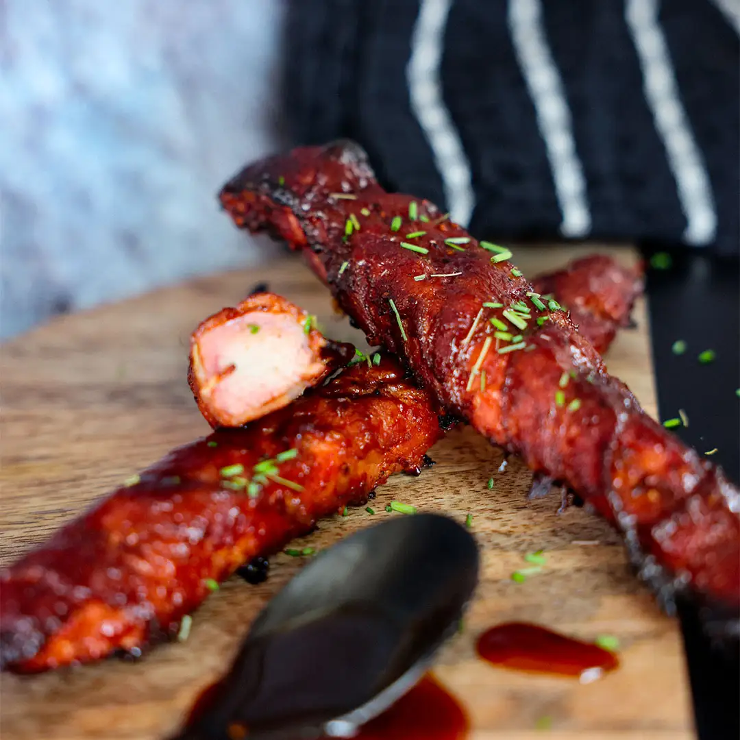 Bâtonnets de filet de porc enrobés de bacon