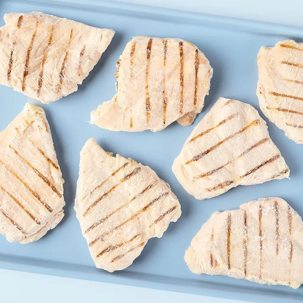 Poitrines de poulet désossées congelées, sans filet, entièrement cuites et assaisonnées