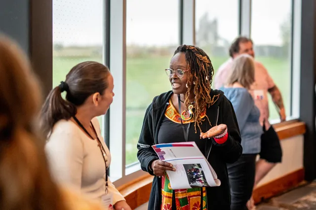 Team members representing The Grey-Bruce Ontario Health Team / Brightshores Health System and Fort Erie Native Friendship Centre exchanging learnings about their initiatives at a program workshop.
