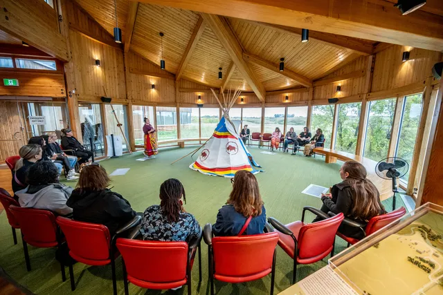 Team members and coaches participating in the Improving Equity in Access to Palliative Care collaborative participating in a land-based learning session facilitated by Wanuskewin staff.