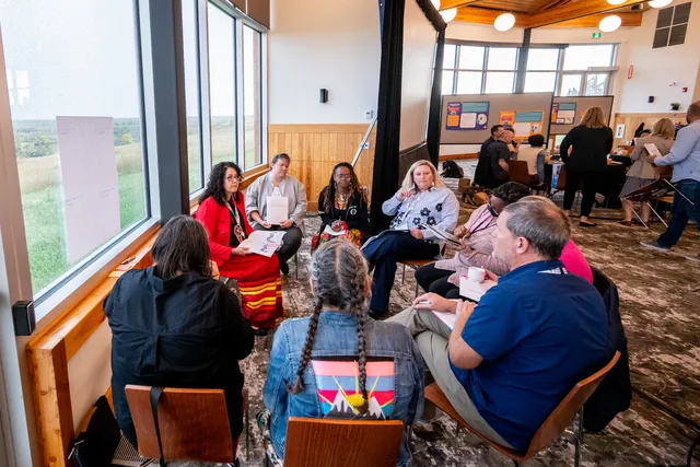 Dr. Holly Prince, one of the Improving Equity in Access to Palliative Care coaches, facilitating group discussions with team members representing Alberta Health Services, Champlain Hospice Palliative Care Program, Bruyère, Fort Erie Native Friendship Centre, Niginan Housing Ventures, and NL Health Services – Labrador-Grenfell Zone at a program workshop.
